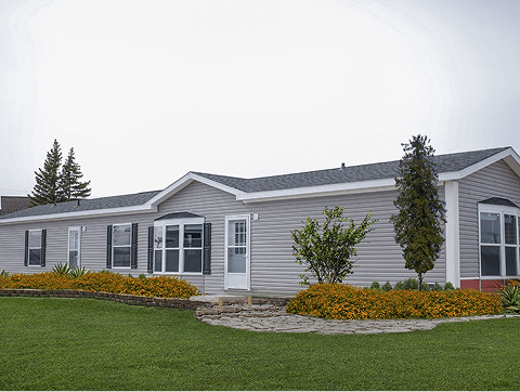 The outside view of a home with grey siding